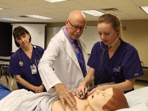 Concordia nursing instructor with simulation manikin and students