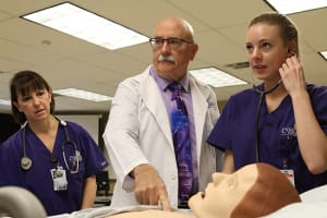 Concordia nursing instructor with student in skills lab