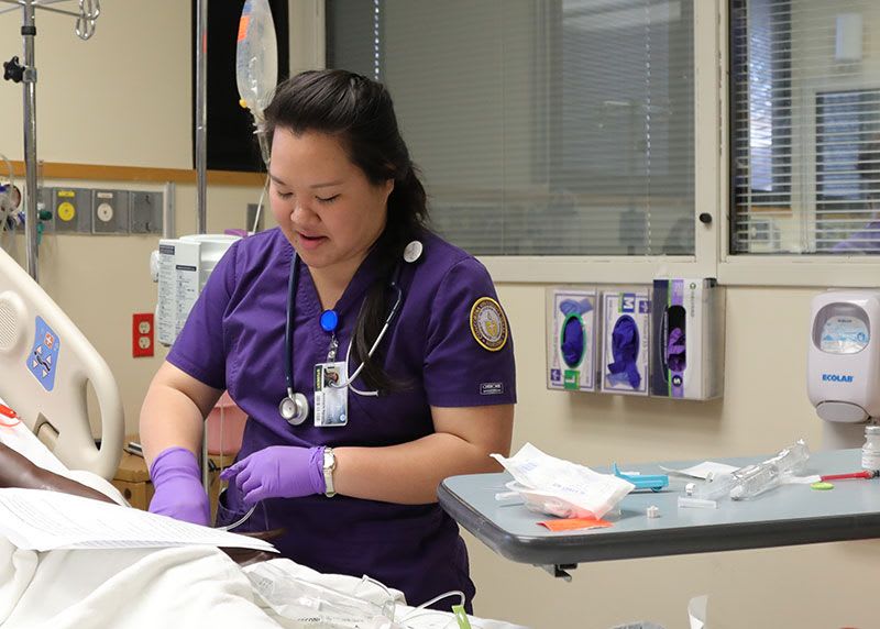 ABSN student working in sim lab