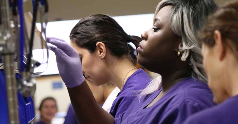 CTX ABSN students looking at lab supplies