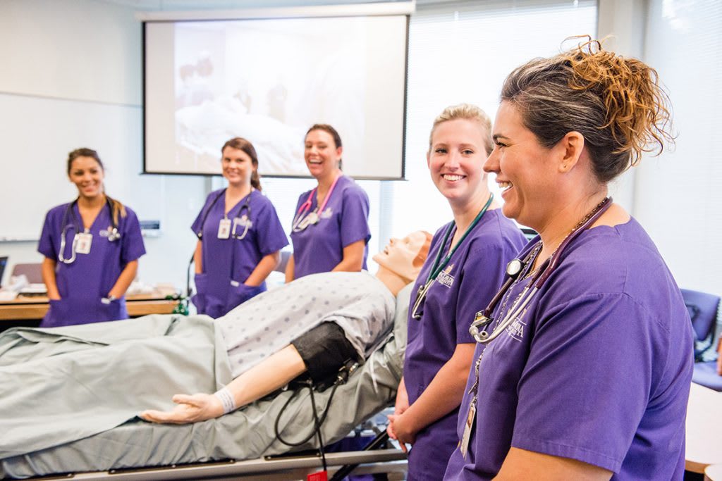 CTX nursing students standing in simulation lab