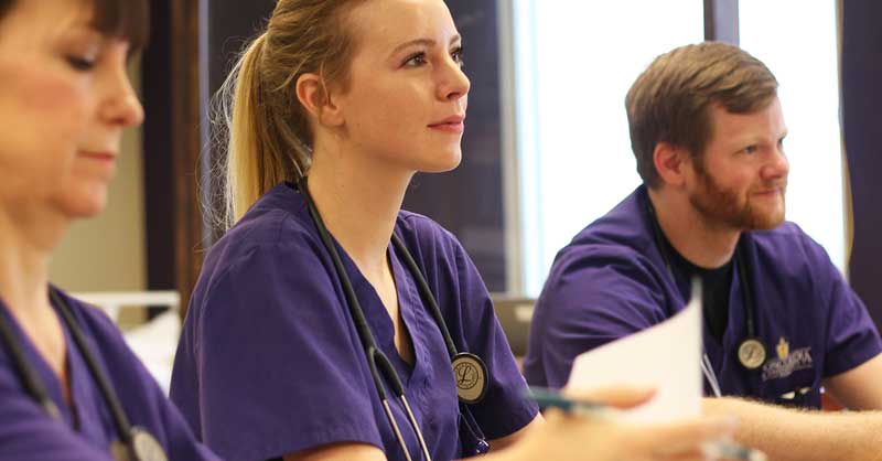 three CTX ABSN students sitting in class