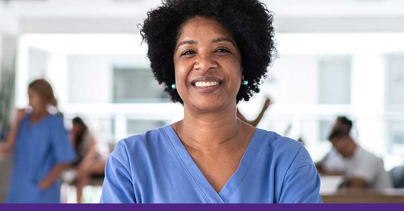 Nurse wearing scrubs smiling