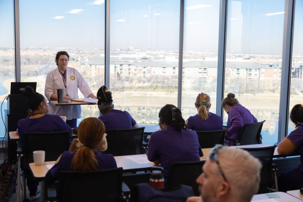 students sitting at desks in classroom