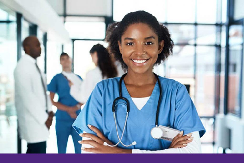 nurse standing in hospital smiling