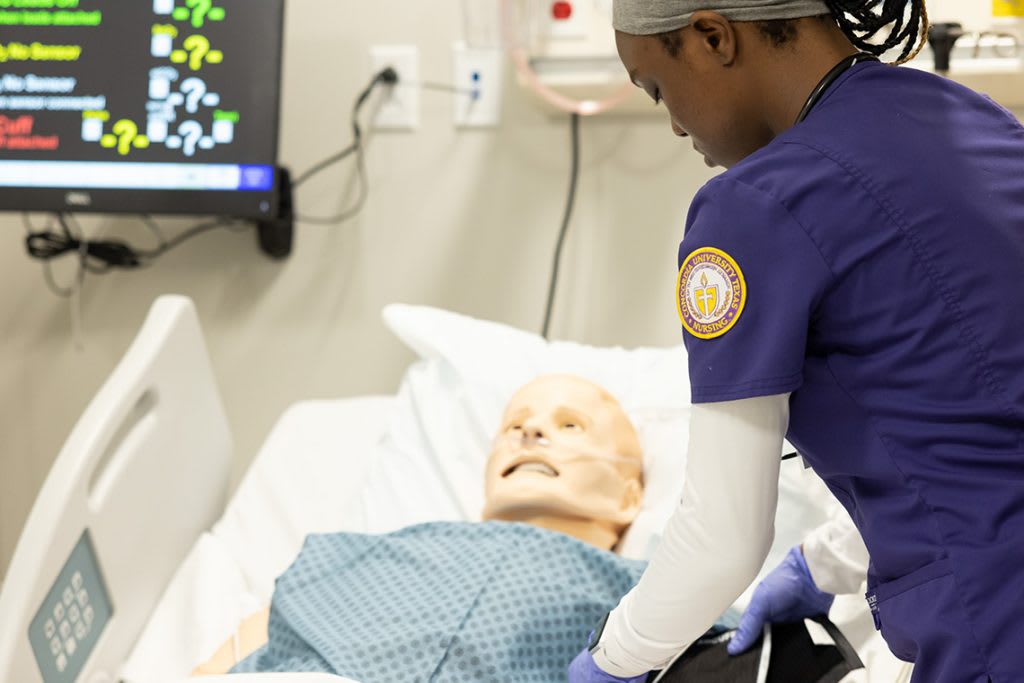 ctx nursing student practicing on manikin