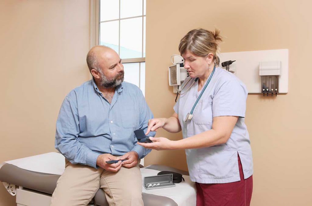 nurse talking with patient