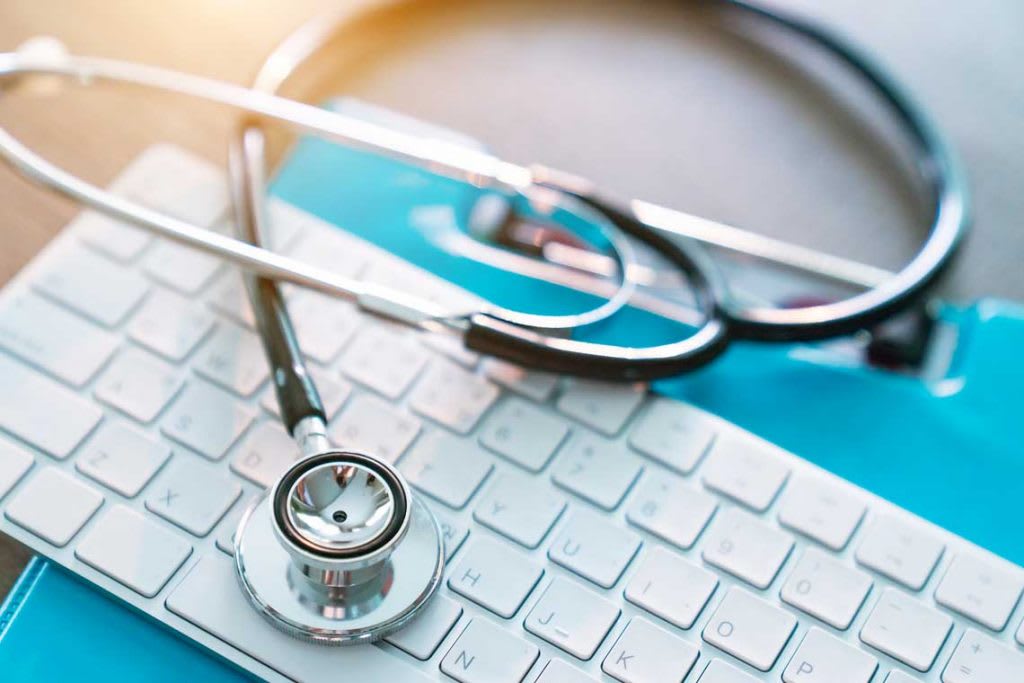 stethoscope on top of keyboard