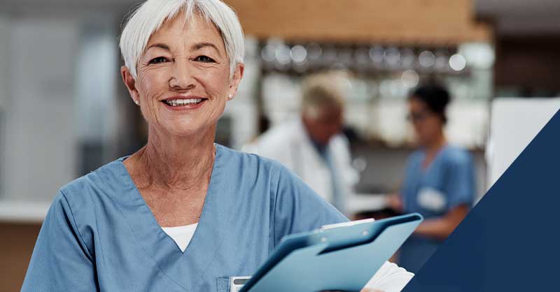 Nurse standing holding clipboard