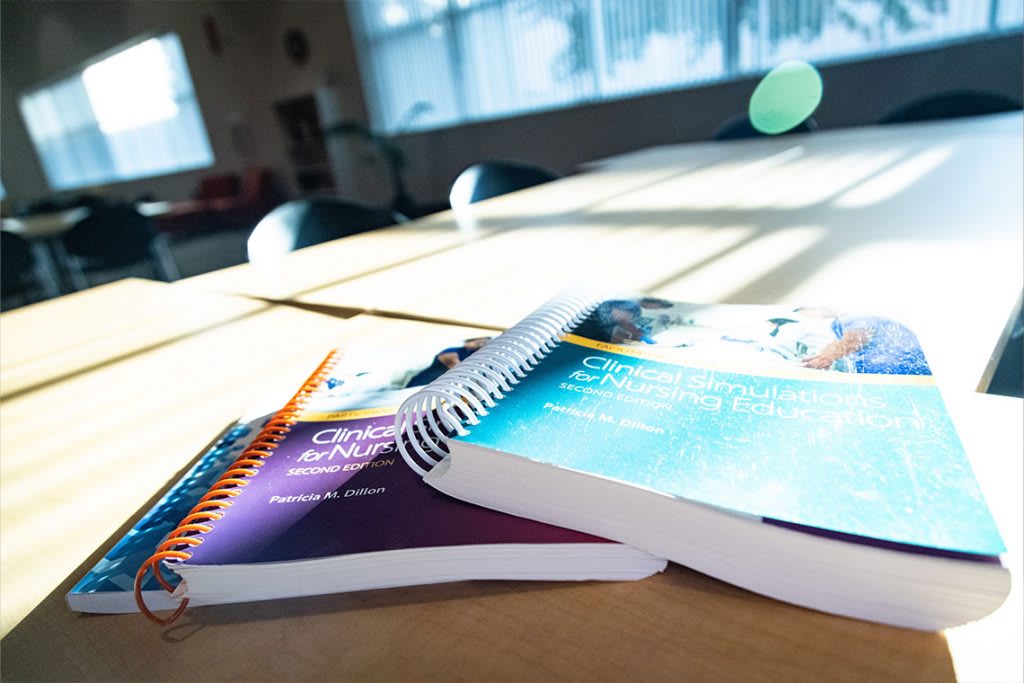 nursing textbooks on a desk