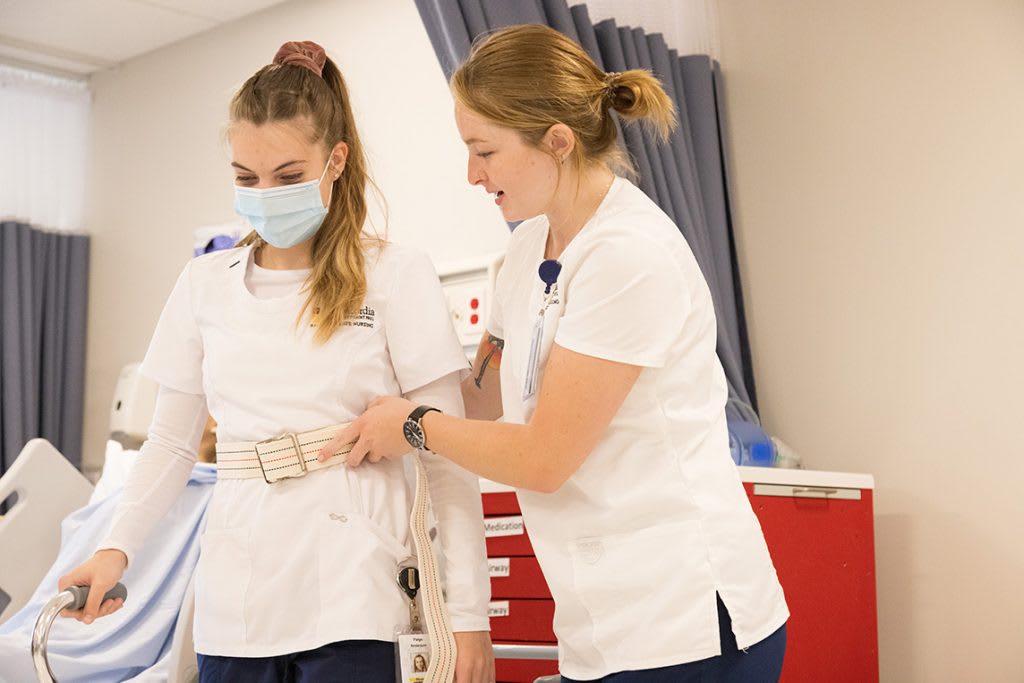 nursing students practicing skills in skills lab