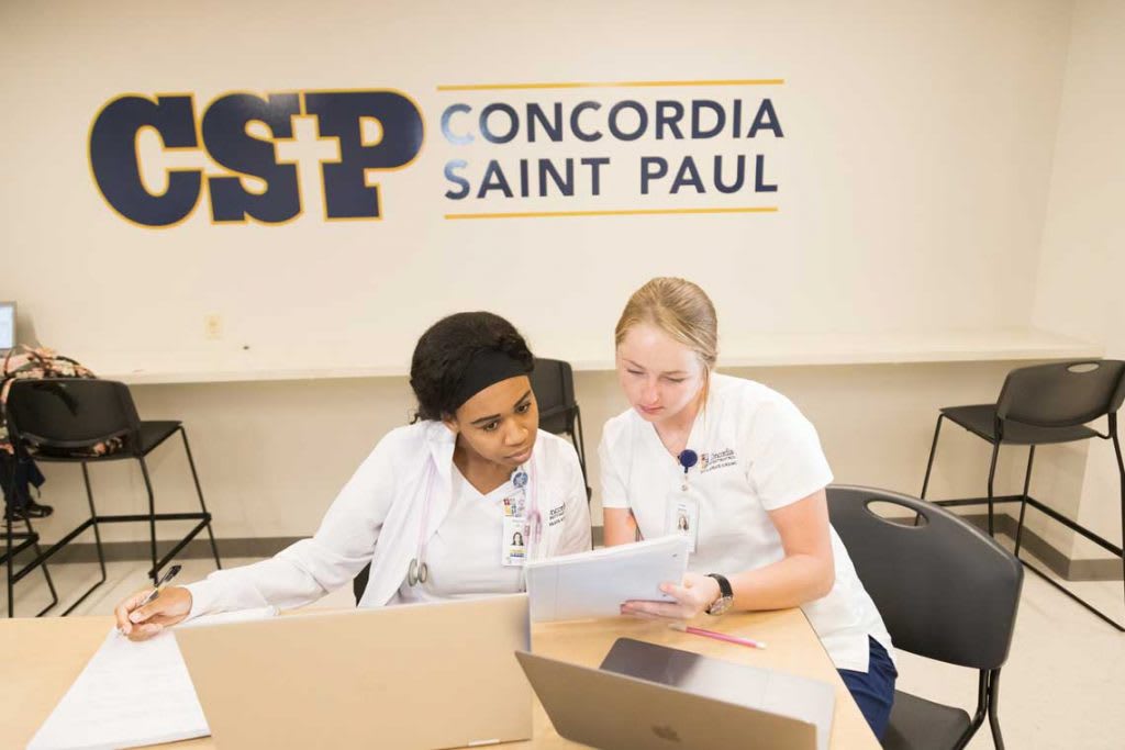 two CSP nursing students sitting and studying