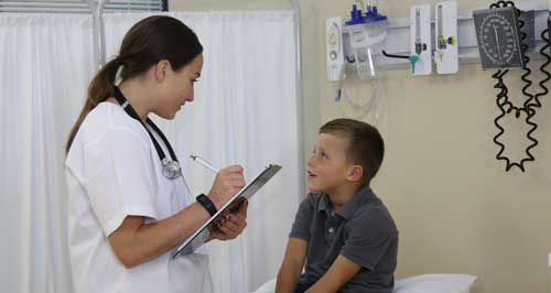 Nursing student with pediatric patient