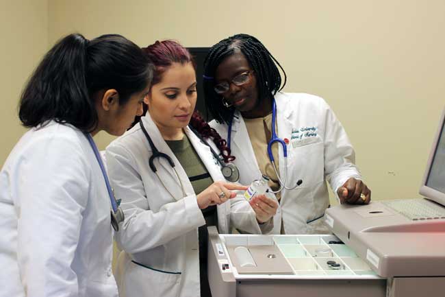 Nursing students in lab coats