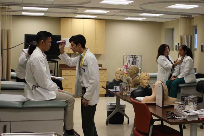 Felician ABSN students working in skills lab