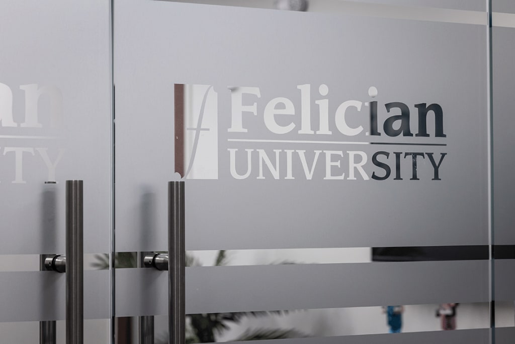 Felician University logo etched in glass door