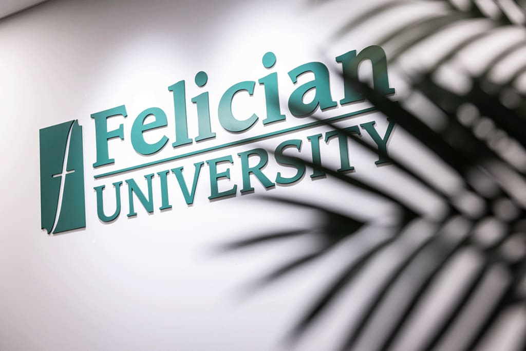 Felician University logo on wall