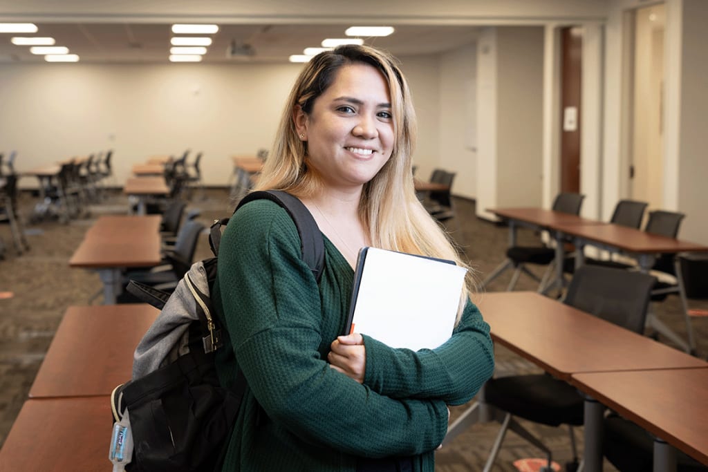 Felician nursing student holding books