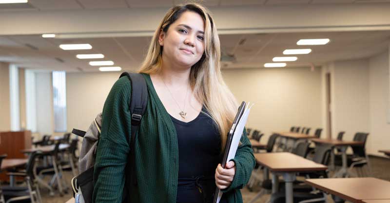 Felician ABSN student holding laptop