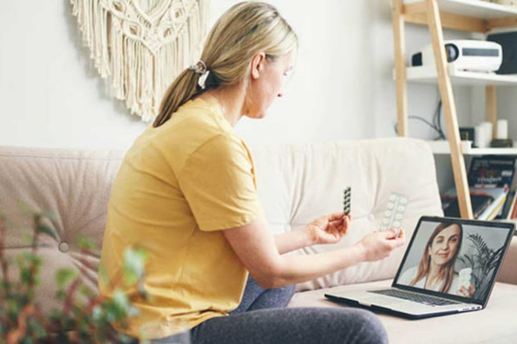 patient video chat with nurse on laptop