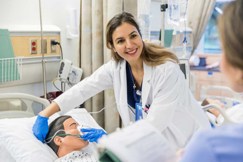 nurse with manikin