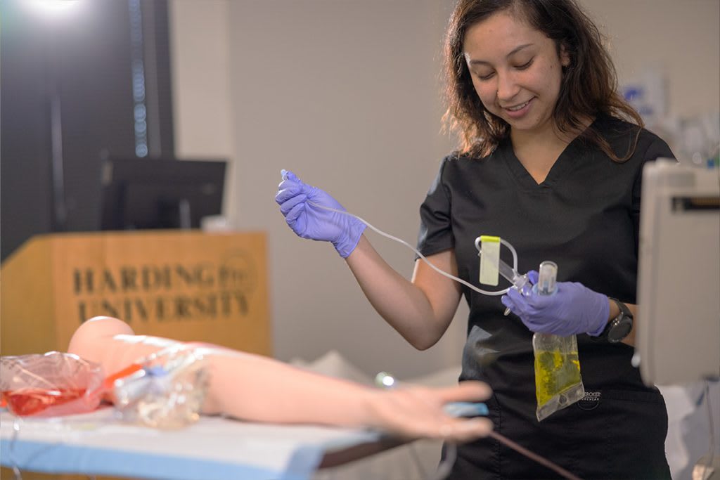 harding nursing student practicing on manikin arm