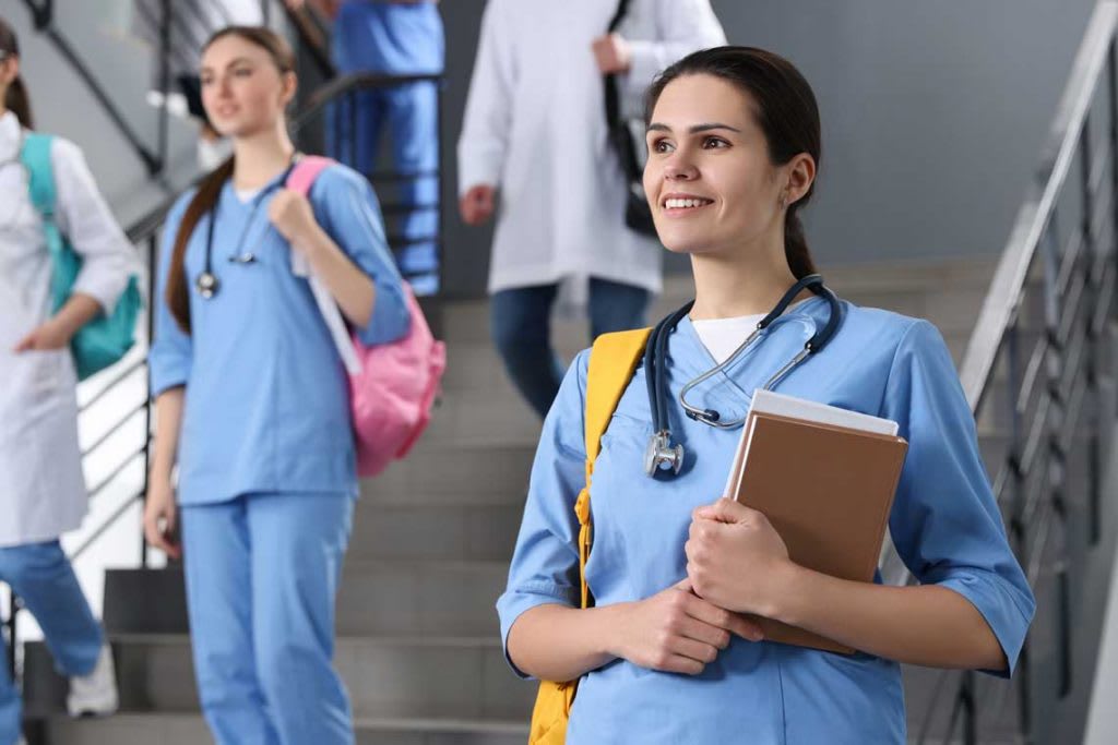 nursing students on stairs