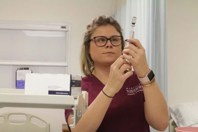 Nursing student working in lab