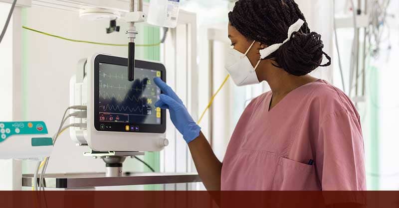 nurse using touchscreen in hospital