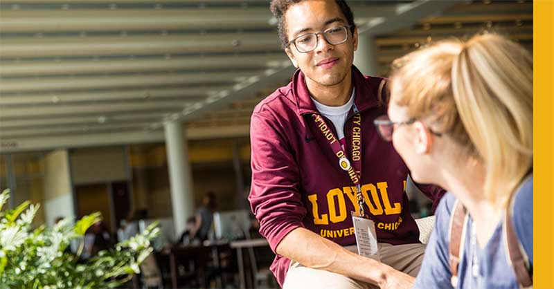 Loyola students sitting outside together