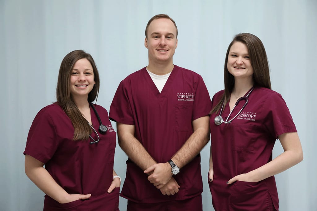 portrait of three Loyola nursing students