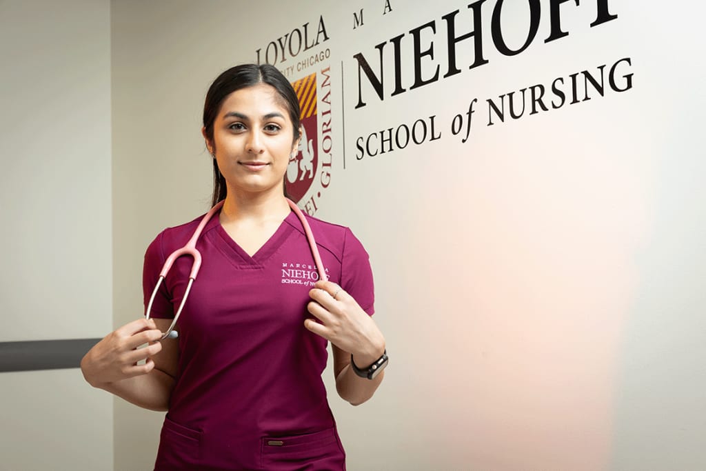 Nursing student holding stethoscope