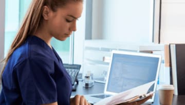nursing student studying in front of a computer