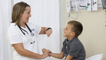 Nursing student with pediatric patient