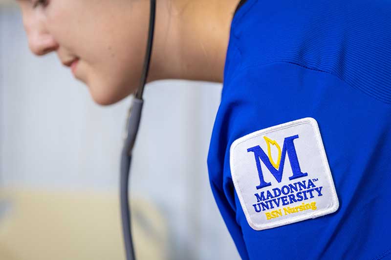 closeup of Madonna ABSN student blue scrubs