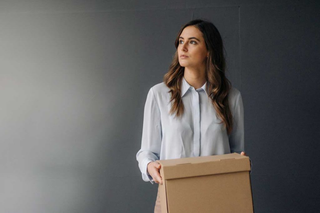 woman holding moving box