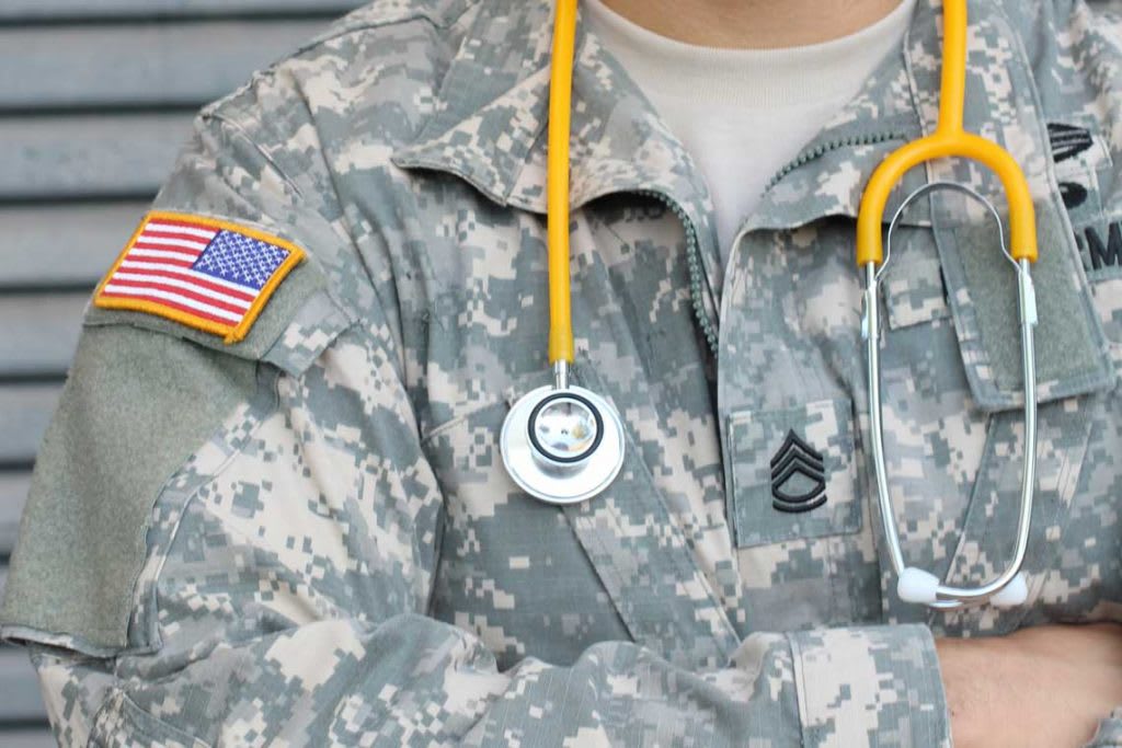 army fatigues and stethoscope around the neck