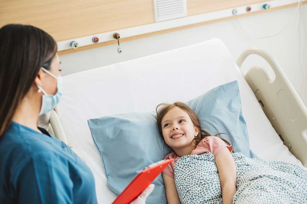 nurse talking to child patient