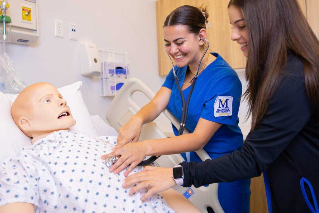 madonna nurses with mannequin