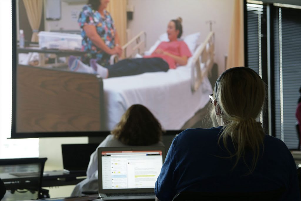 nursing students looking at screen