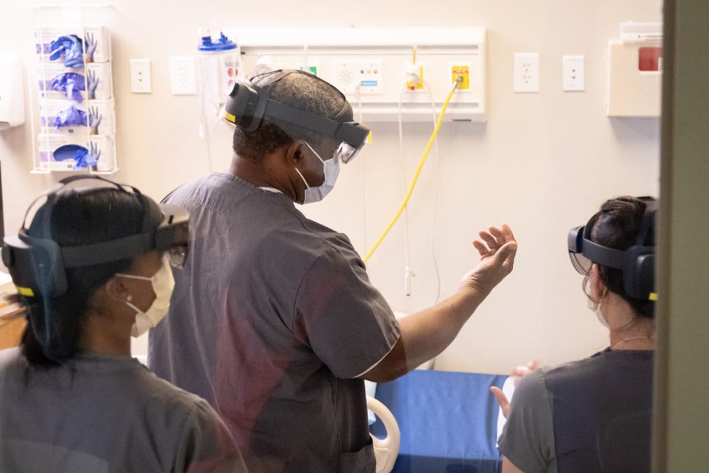 nursing students practicing skills in skills lab