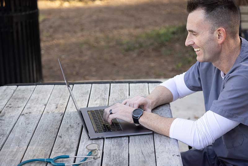 nursing student using a laptop