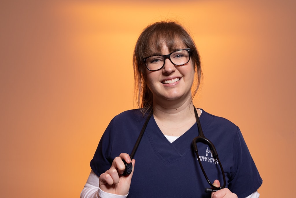 nurse in front of orange halo lighting