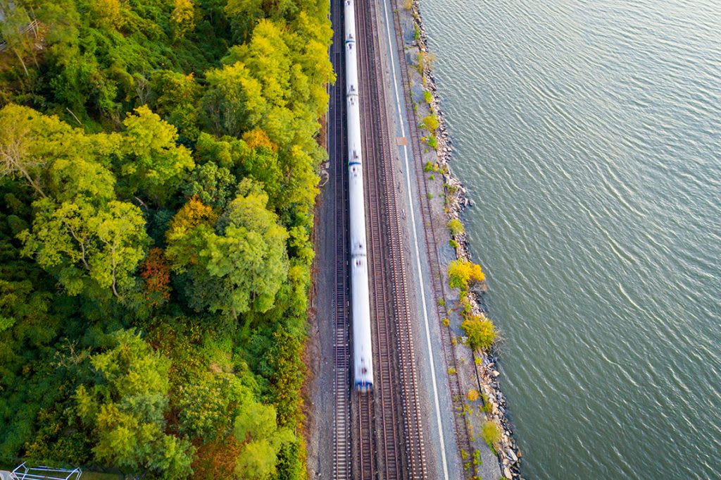 train on track next to water