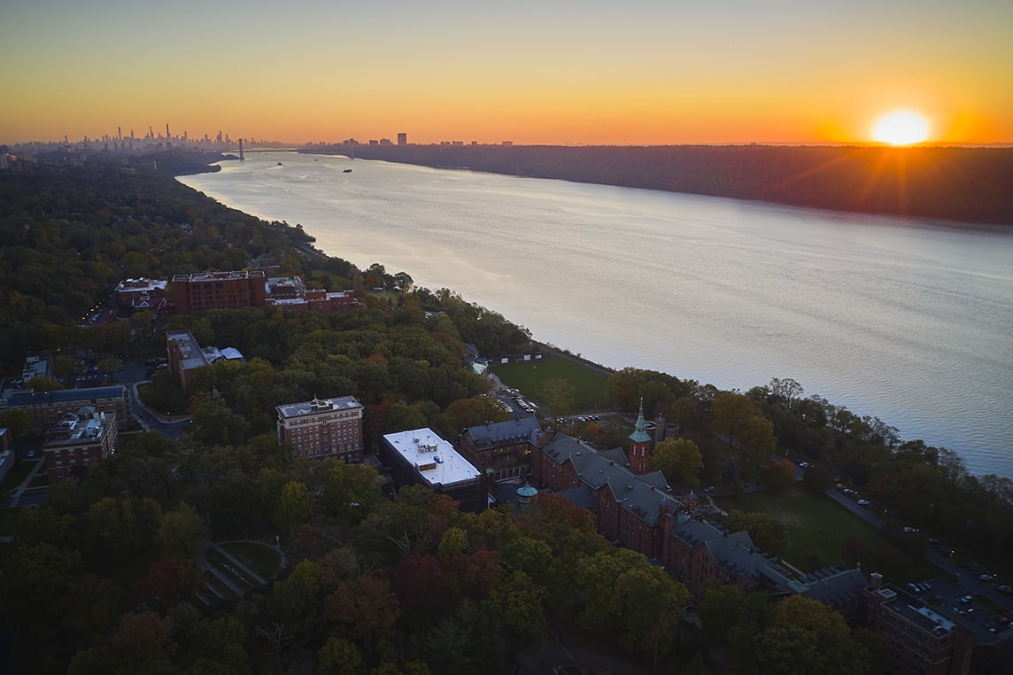 campus shot with sunset and water