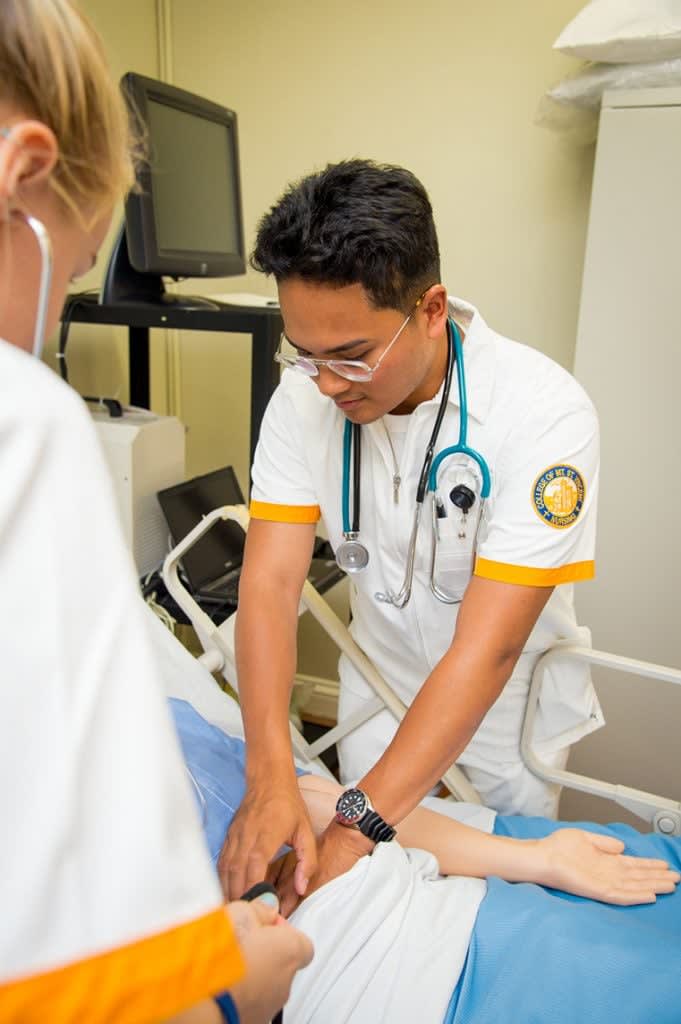 CMSV nursing student in lab with manikin