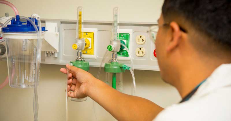 nursing student holding lab equipment