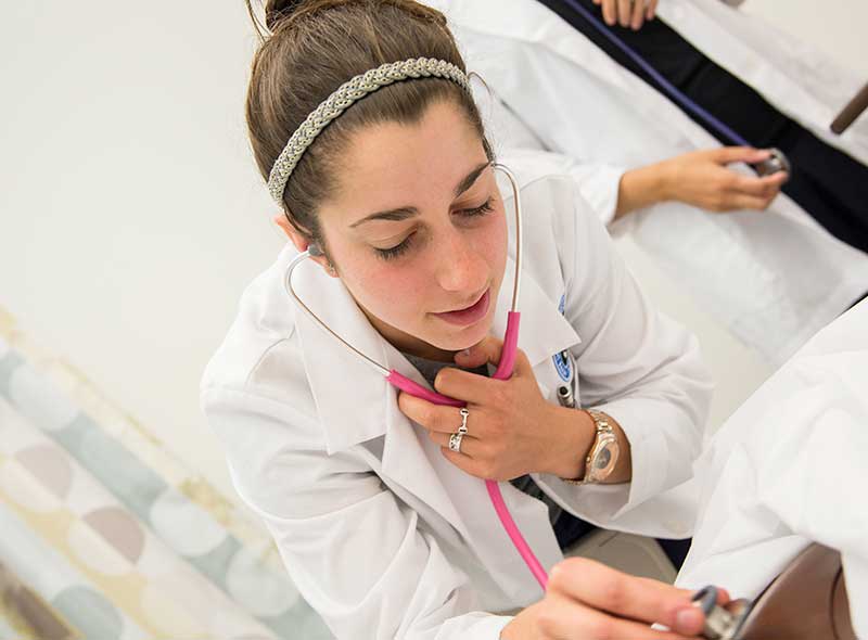 nursing student using stethoscope