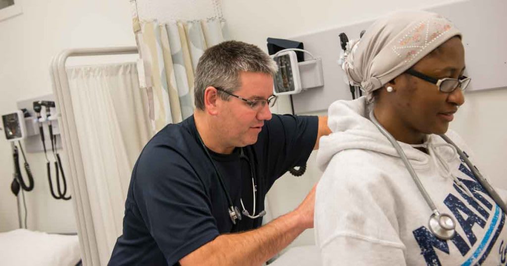 nursing student practicing in skills lab