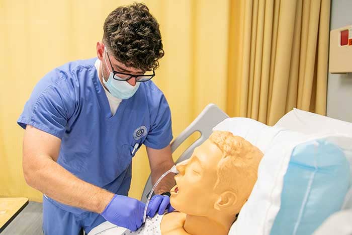 Notre Dame of Maryland University nursing student working in sim lab